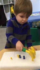 boy with toy hammer