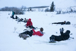 The students learn to fall and get back up on their cross country skis, an important skill.