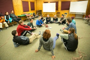 The group discusses what they learned about leadership, teamwork and communication by playing blind dodgeball.