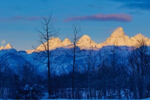 Sunrise on the Tetons with the setting full moon.