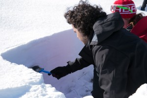 The face of the snow pit gets brushed off by Josh.