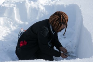 MaryGrace removes wedges of snow to be weighed.