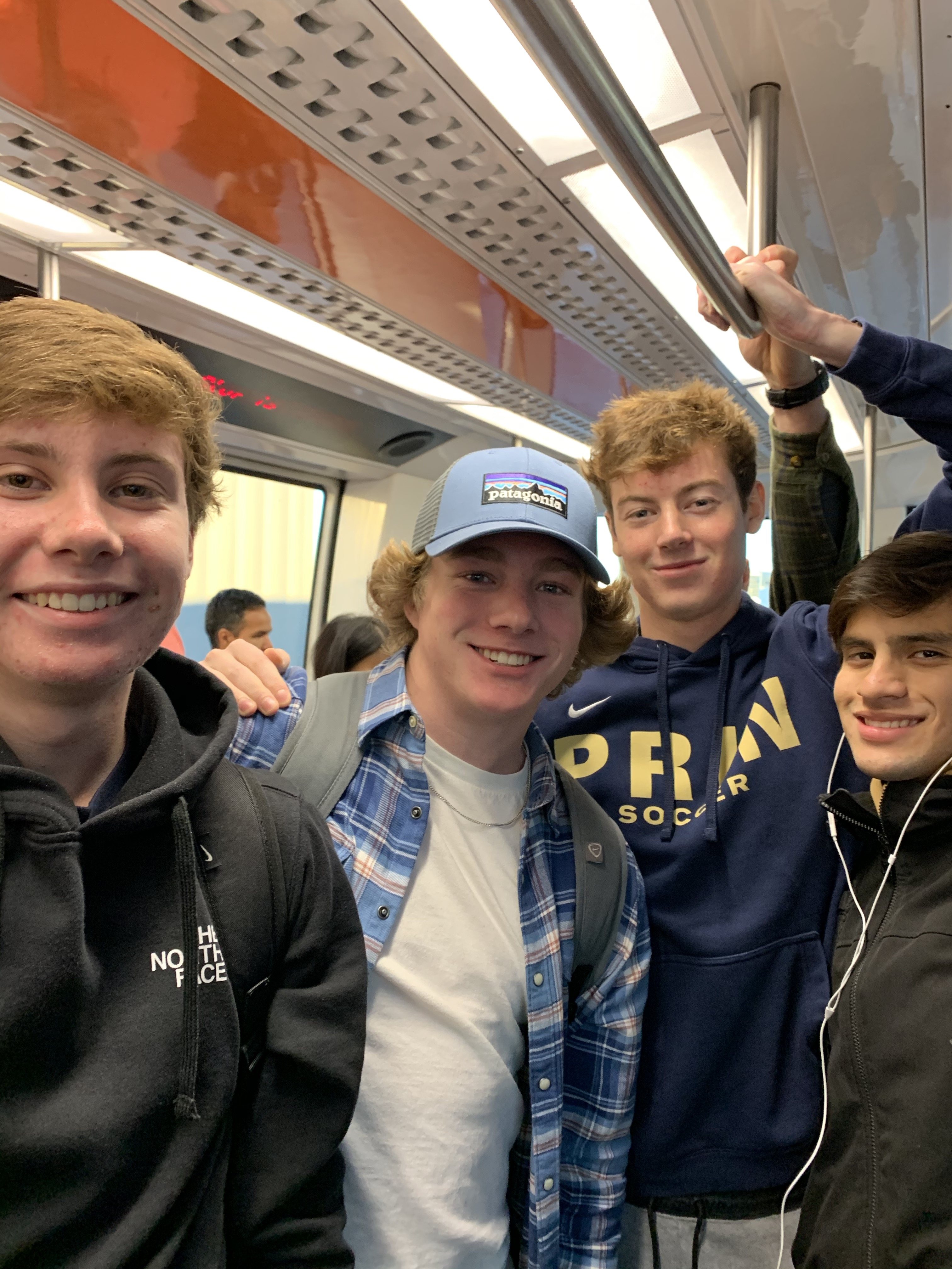 Jimmy, Japhet, Kian, and Diego - riding the tram at DFW