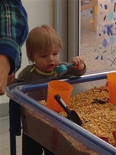 Child playing with sensory table